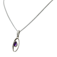 Load image into Gallery viewer, Stylish long oval pendant with a similarly oval shaped Amethyst Gemstone
