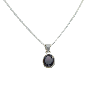 Cute oval faceted Garnet pendant set on a deep bezel setting