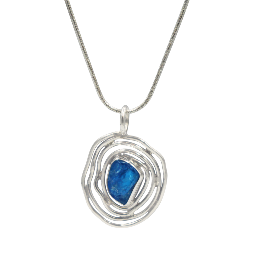 A beautiful rough Neon Apatite pendant accent with an elegantly handcrafted sterling silver spiral base.