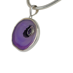 Round Purple Agate has a beautiful faceted Amethyst stone set inside the natural hollow of the agate