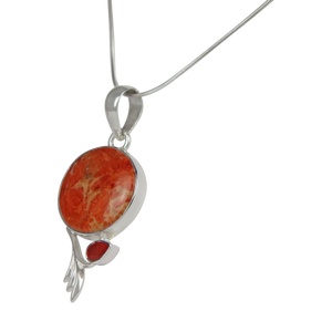 This beautiful orange colour round Sponge Coral pendant is set in an open back bazel.