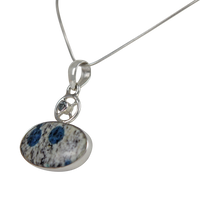 Load image into Gallery viewer, A charming Oval Shaped K2 Jasper Pendant Accent with a Tiny Blue Topaz on a Wagon Wheel
