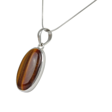 Load image into Gallery viewer, A simple an elegant Tiger&#39;s Eye Pendant set in a open back Sterling Silver bazel
