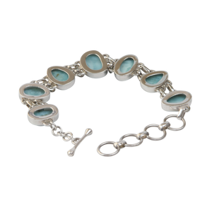 An Exquisite Double Linked Sterling Silver Bracelet with 7 unique shaped Larimar Crystals