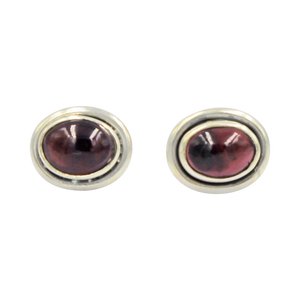 Oval Garnet gemstone stud earrings with a sterling silver surround