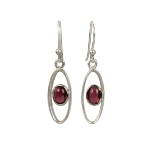Elegant oval drop sterling silver earrings holding a garnet