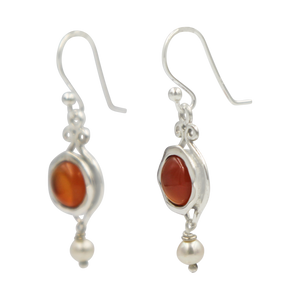 A lovely unique and a very intricate design of Sundari ethnic pair of earrings with round cabochon stone.