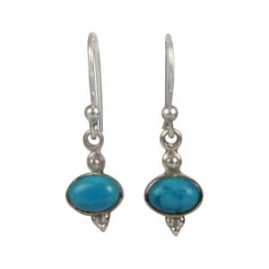 Minimalistic turquoise drop earrings set into sterling silver in a classic ethnic style