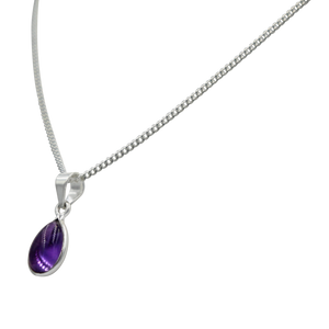 Delicate small teardrop cabochon gemstone pendant set in a thin bezel setting