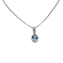 Load image into Gallery viewer, Stunning oval faceted Blue Topaz on a thin bezel setting exposing much of the shiny stone
