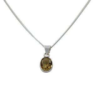 Cute oval faceted Citrine pendant set on a deep bezel setting