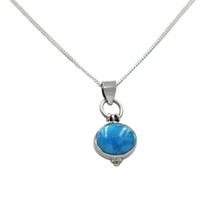 Oval Shaped simple but elegant pendant with a cabochon Turquoise stone
