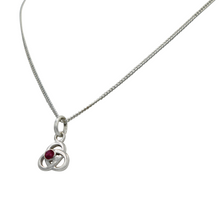 Load image into Gallery viewer, Celtic pendant with a half sphere faceted Ruby
