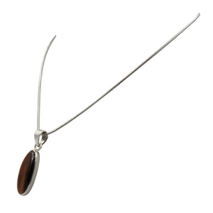 Handcrafted long oval shaped cabochon Tiger's Eye pendant presented on 18" Sterling Silver Chain