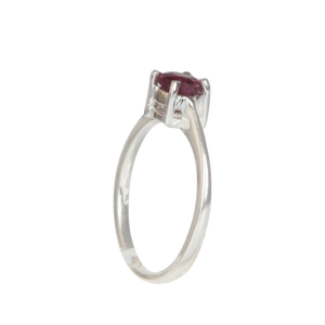 A simple and elegant sterling silver ring with a claw set, multifaceted gem stone