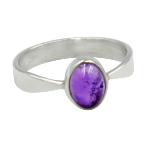 A very delicate ring in sterling silver with two slight curves  in the shank and a small oval Amethyst cabochon stone