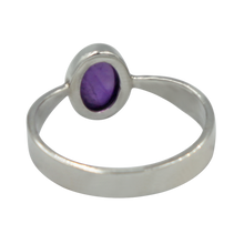 Load image into Gallery viewer, A very delicate ring in sterling silver with two slight curves  in the shank and a small oval Amethyst cabochon stone
