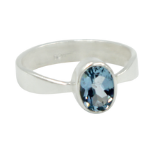 Load image into Gallery viewer, A very delicate ring in sterling silver with a small faceted oval Blue Topaz stone.
