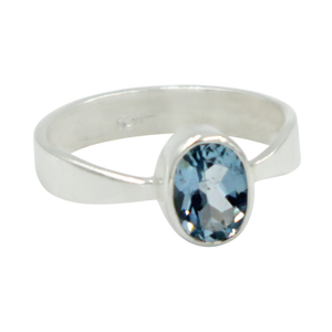 A very delicate ring in sterling silver with a small faceted oval Blue Topaz stone.