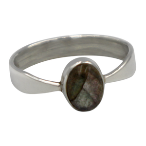A very delicate ring in sterling silver with two slight curves in the shank and a small oval cabochon stone.