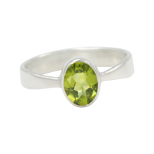 Load image into Gallery viewer, A very delicate ring in sterling silver with a small faceted oval Peridot stone.
