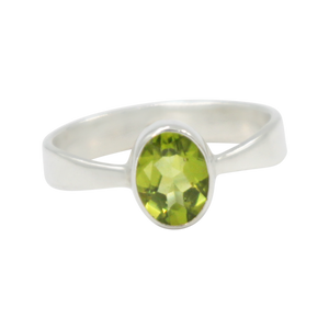 A very delicate ring in sterling silver with a small faceted oval Peridot stone.