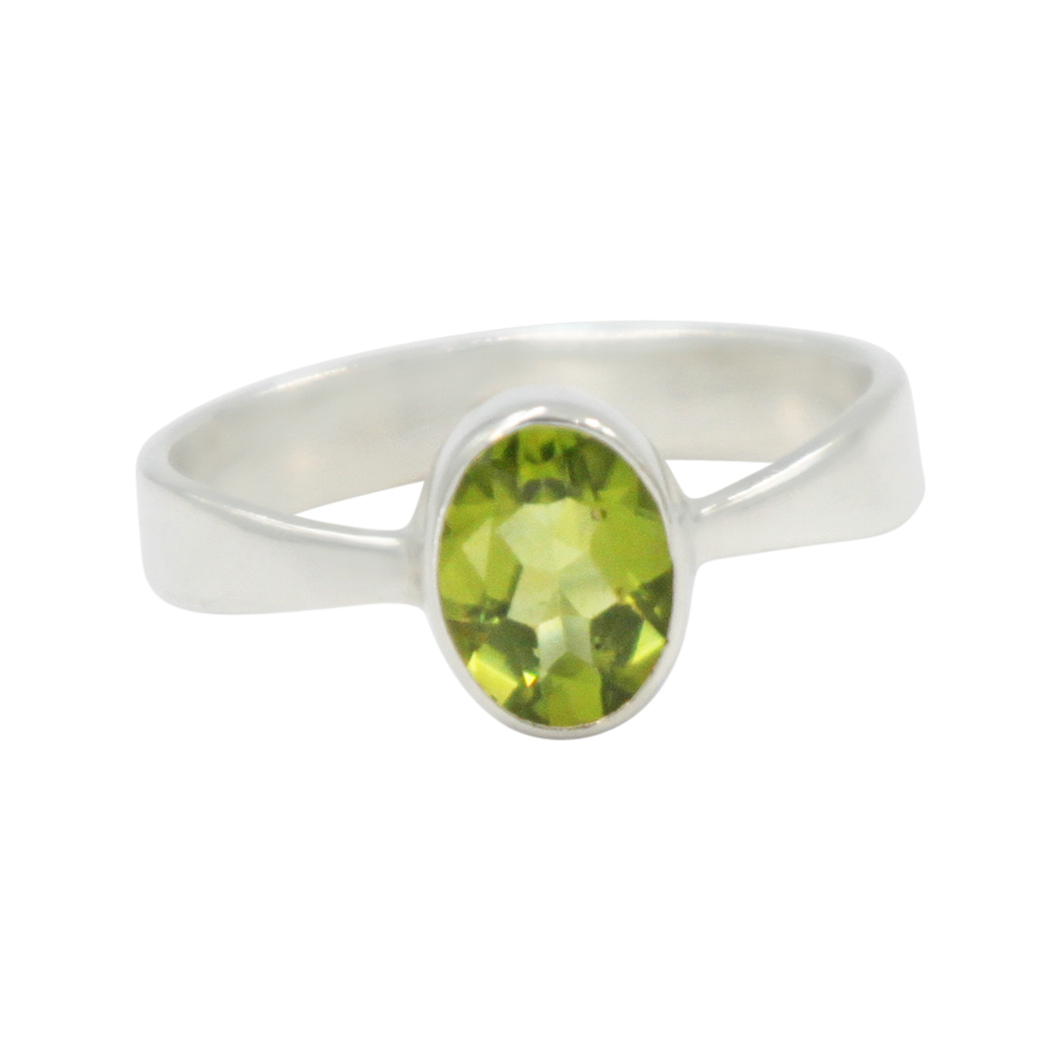 A very delicate ring in sterling silver with a small faceted oval Peridot stone.