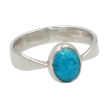 Load image into Gallery viewer, A very delicate ring in sterling silver with two slight curves in the shank and a small oval cabochon stone.
